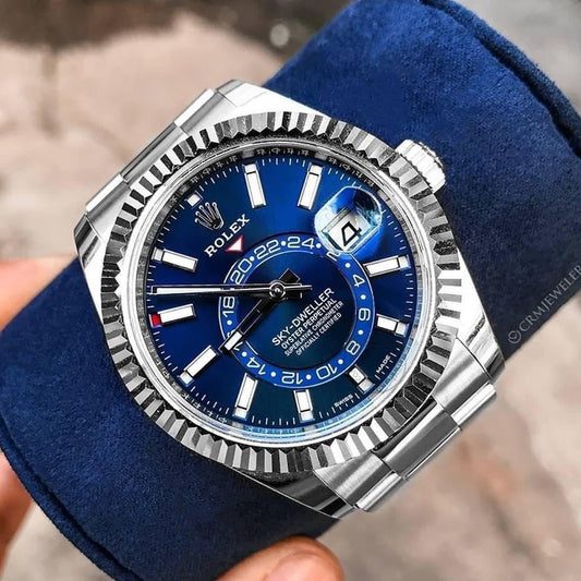 Oyster Perpetual Sky-Dweller in White Rolesor with a bright blue dial and an Oyster bracelet. RLX Sky-Dweller RLX-DWELLER